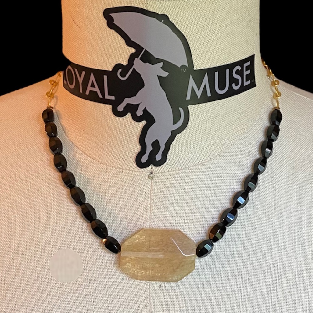 Smokey Quartz with Black glass beads on gold chain.